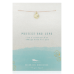 Lucky Feather Shell Necklace on display card reading "Protect and heal like a seashell, I'm always here for you". Gold shell charm on nylon cord.