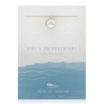 Lucky Feather Wave Necklace on display card reading "Life's an adventure ride the waves". Silver necklace with wave line on nylon cord.