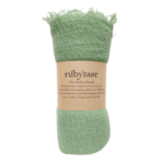 The Boho Shawl Pea Green rolled up with Rubyzaar packaging of brown paper with product name and description written in black. Displayed on white background.