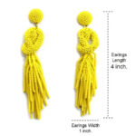 Beaded Post Statement Earrings Yellow shown on white background. Displaying the earring length of 4 inches and width of 1 inch. Post earring is made with yellow seed and bugle beads and is in a knot pattern with beaded fringe hanging down below the knot.